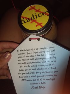 a person holding a jar with some kind of paper on it's side and an ad for radice