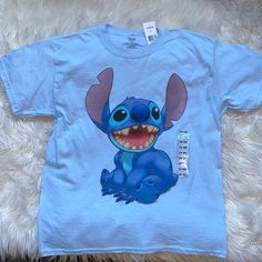 a blue t - shirt with an image of stitching stitchs on the front