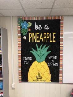 there is a sign that says be a pineapple on the wall in this classroom