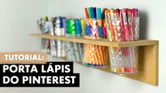 a shelf filled with lots of different colored pencils on top of wooden shelves next to each other