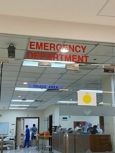 an emergency department entrance with people in the background