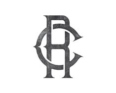 the letter b is made out of metal and has an arrow on it's side