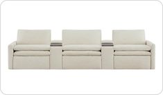 a white couch with three recliners sitting on it's sides and the back end