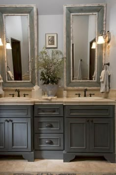 two sinks and mirrors in a bathroom