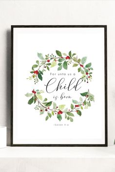 a framed print with the words for unto us a child is born in green and red