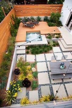 an aerial view of a small backyard with a hot tub