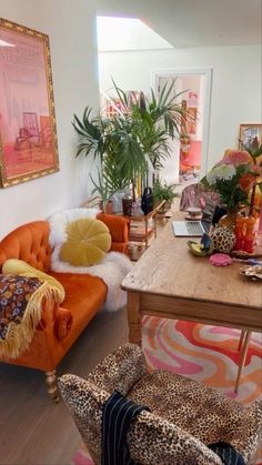 a living room filled with furniture and lots of plants