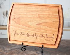 a wooden cutting board with writing on it