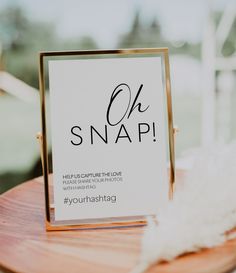 a sign sitting on top of a wooden table next to a white fluffy animal tail