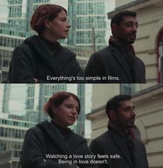 two people standing next to each other in front of tall buildings with the words everything's too simple in films watching a love story feels safe being in love doesn't