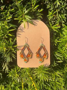 🌼Decorate yourself with these exquisite earrings, featuring high-quality Czech glass beads in alternating shades of y brown, orange and gold. Their lightweight design and vibrant colors make them perfect for daily wear. 🌿Design Highlights🌿 Beads: Premium Czech glass beads in  brown, orange and gold.  Hoops: earring length 3,5 cm , the ideal size for both casual and formal occasions Stone: orange Agat 🌿Why You'll Love These Earrings🌿   Elegant and Lightweight: The delicate design and light m Hippie Earrings, Handmade Glass Beads, Beads Earrings, Gold Earring, Boho Stil, Stylish Jewelry, Jewelry Earrings Hoops, Elegant Earrings, Czech Glass Beads