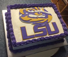 a cake with the lsu logo on it is sitting on top of a countertop