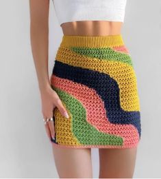 Free People - Crochet Knit Mini Skirt in Multicolor Swirl ✨ So classic in crochet, this bold mini skirt is featured in a slim, low rise silhouette with multicolored striped pattern and unlined design for that classic beachy look!  Features pull on style with ribbed elastic waist, loose open decorative knit pattern, great classic colors of gold, navy, pink and green.  Wonderful for layering or wearing over your swimwear.  Pair to perfection with vintage baby tees! NWOT & discontinued online! No known imperfections.  This is a lovely skirt with a very soft cotton feel!  Comfy easy wear. Size: L, best fits 32"-34"! Refer to measurements to ensure desired fit! Waist: 16 1/2 inches  Hip:  20 inches Width of stretch/ waist band:  1 3/4 inches Waist stretched: 19 1/2 inches Total skirt Length: 14 Fitted Multicolor Mini Bottoms, Crochet Patch Skirt, Spring Crochet Multicolor Bottoms, Yellow Crochet Skirt Outfit, Spring Multicolor Crochet Bottoms, Fitted Multicolor Crochet Bottoms, Fitted Multicolor Color Block Skirt, Cheap Retro Multicolor Mini Skirt, Retro Yellow Fitted Mini Skirt