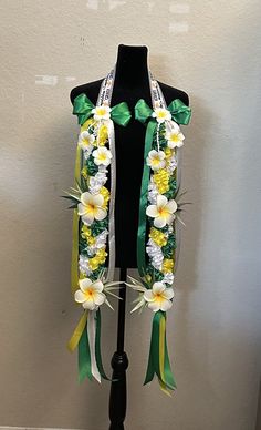 a mannequin is adorned with flowers and ribbons