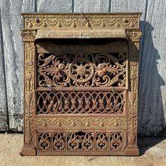 Antique Architectural Salvage Ornate Victorian Arts and Crafts Cast Iron Fireplace Surround With 3 Piece Grill Summer Cover. Circa late 1800s. It is in good condition with minor surface oxidation, minor surface wear appropriate to age, gold paint finish, and is missing some of the mounting screws for the grill components. Also has some damage and bending to the lower part of the sheet metal back (see photos for details). Measurements as follows: Height: 30 3/4 inches  Width: 26 inches Hannibal Mo, Antique Architectural Salvage, Metal Fireplace, Fireplace Cover, Iron Fireplace, Cast Iron Fireplace, Antique Fireplace, Fireplace Screens, Fireplace Surround