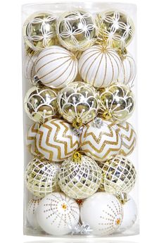 white and gold christmas ornaments in a package