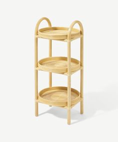 three tiered bamboo tray with handles on each side and two circular sections at the top