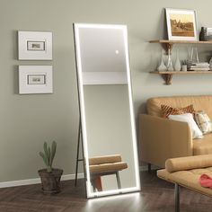 a living room scene with focus on the floor mirror