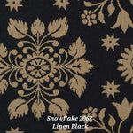 a black and gold wallpaper with white flowers