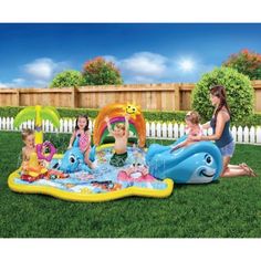 children playing in an inflatable pool