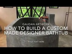 a large cement bathtub sitting inside of a bathroom next to a window with the words, how to build a custom made designer bathtub