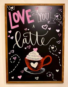 a chalkboard sign that says love you a latte