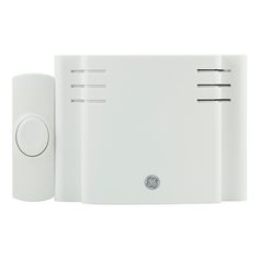 a white wall mounted device with two buttons on each side and one button on the other side