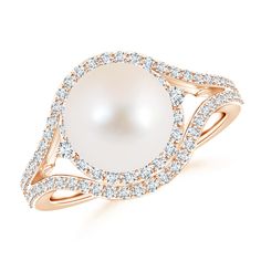 a white pearl and diamond ring in 18k rose gold with diamonds around the band