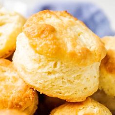 some biscuits are piled on top of each other in a blue and white bowl,