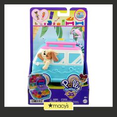 a toy car with a dog on the top in a packaging for play doh