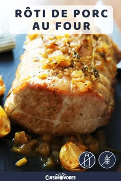 a piece of meat sitting on top of a blue plate next to potatoes and carrots