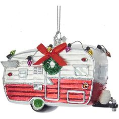 a christmas ornament shaped like an rv