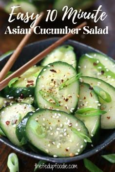 cucumber salad in a bowl with chopsticks and sesame seeds on the side