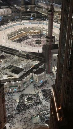 an aerial view of the ka'bah in the middle of the city at night