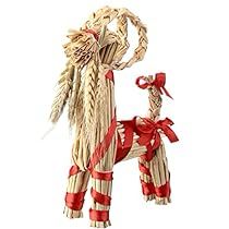 an ornament made out of straw and rope with a red ribbon on it