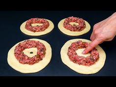 four pizza doughnuts being made on top of each other