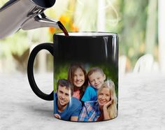 a coffee mug is being filled with liquid from a funnell and has the image of two children on it