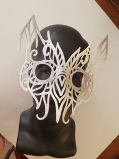 This handcrafted filigree mask was drawn in India ink, and the converted to 3D to print. It is lightweight, comfortable, and looks great for your victorian-era, Renaissance, or any other owl costume. Request any custom color paint job. White Masks And Prosthetics For Masquerade And Cosplay, Handmade Fantasy Halloween Mask, Handmade Fantasy Costume Masks, Handmade Fantasy Masks And Prosthetics For Carnival, Handmade Fantasy Masquerade Mask For Costume Party, Handmade Fantasy Eye Mask, Artistic White Costume Mask, Artistic White Masquerade Mask For Halloween, Handmade Fantasy Masks For Masquerade