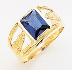 a gold ring with a blue stone in it