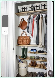 an open closet with shoes, bags and handbags hanging on the wall next to it