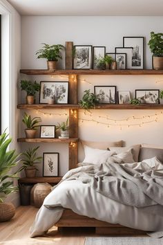 a bedroom with plants and pictures on the wall