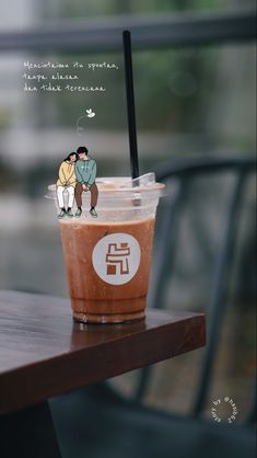 an iced coffee with two people sitting on it