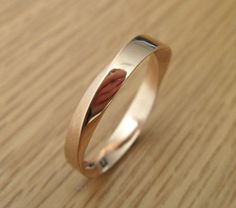 a close up of a ring on a wooden surface