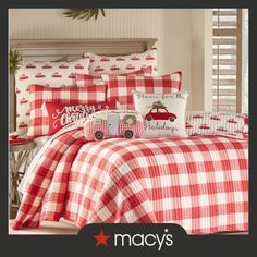 a red and white plaid bed set with christmas decorations on the headboard, pillowcases and comforter