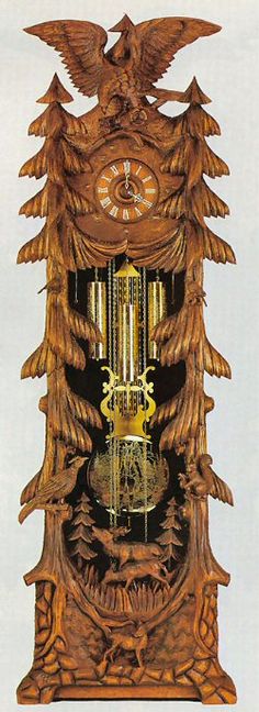 an ornate wooden clock with two birds on it's face and the time displayed