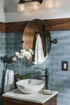 a bathroom sink with a mirror above it