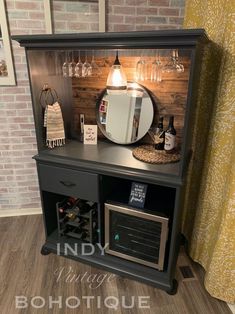 a wine rack with a mirror and bottles on it in front of a brick wall