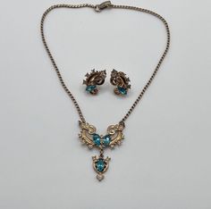 "Absolutely beautiful gold tone with blue and clear rhinestones necklace and screw back earrings set made in the 1940s by Lustern Louis Stern Jewelry Signed Lustern Earrings are 1\"x5/8\" Necklace is 15\" long" 50s Necklaces, 1940’s Jewelry, Japanese Jewellery, Vintage Tarnish-resistant Pendant Necklace, 1940s Necklace Vintage, 1930s Necklace, Rhinestones Necklace, Japanese Jewelry, Micro Mosaic