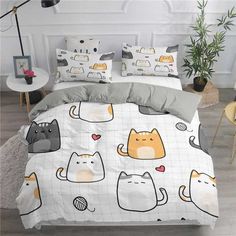 a bed with cats and hearts on it