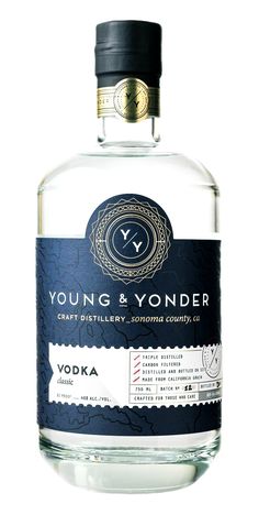 a bottle of young and yonder vodka with a label on the front that says,